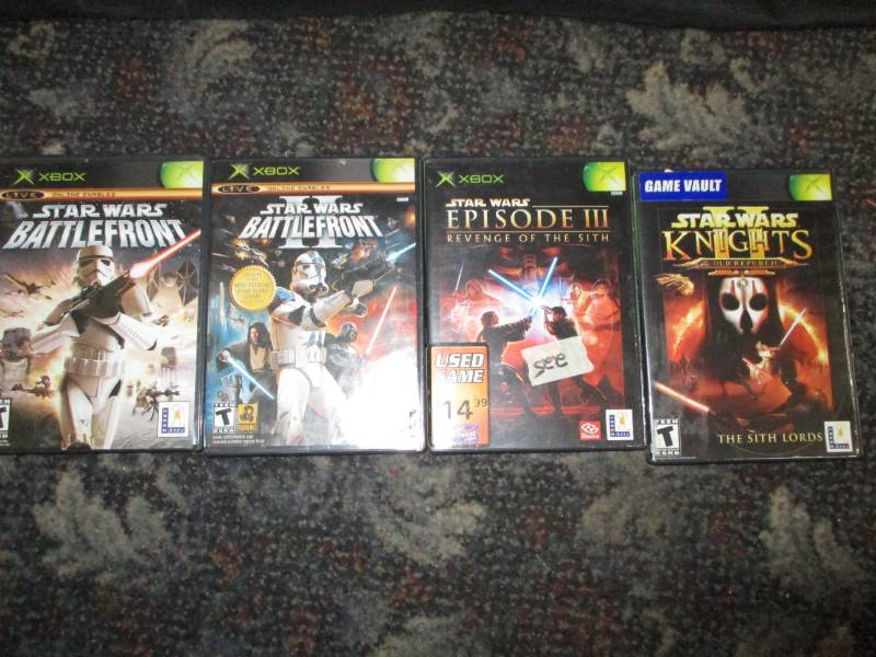 4 Xbox Games, Star Wars Battle front and Battle Front IISony Camera and Battery and charger, Star wars knights and Star Wars Episode III