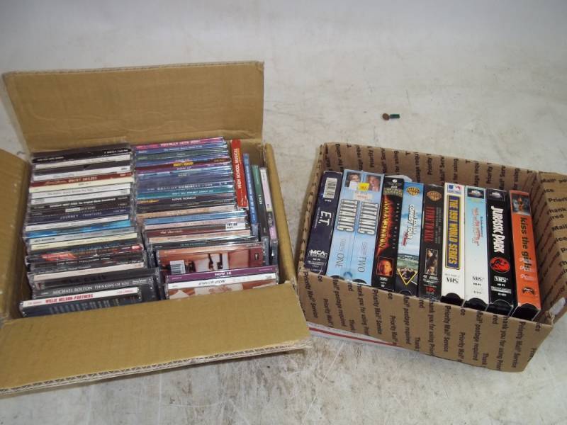 lot 54 image: CDs and VHS Tapes