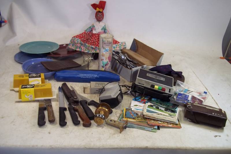 lot 159 image: Large Lot of Assorted items including knives, postcards, plates, and silverware
