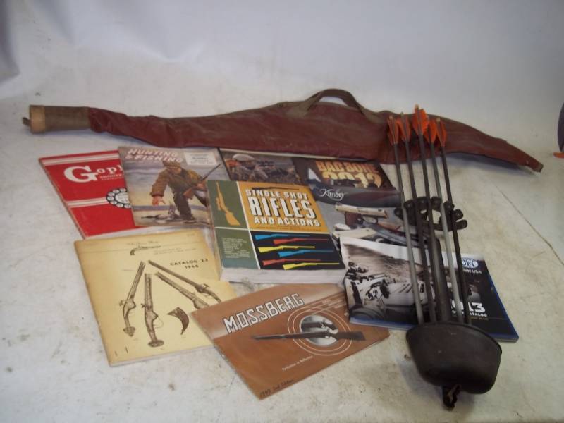 lot 160 image: Hunting Books, brochures, Arrows, and Gun Case