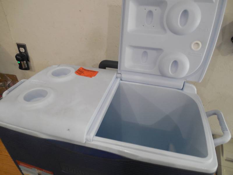 lot 23 image: Rubbermaid 60 Qt. Wheeled Cooler