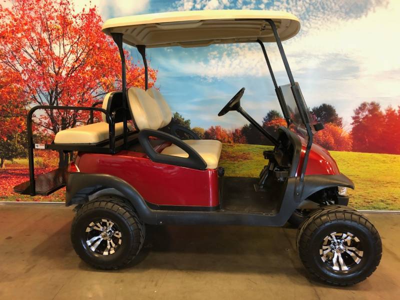 lot 1 image: Club Car Red Lifted 4 Passenger Golf Cart