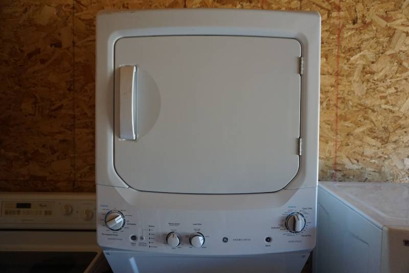 lot 1 image: GE Stacked Washer and Dryer