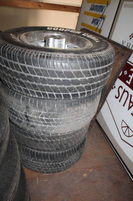 lot 22 image: Lot of (4) Cooper Cobra Radial GT P22570R14 White Letter Tires w 14in. 5-Lug Chevrolet Wheels