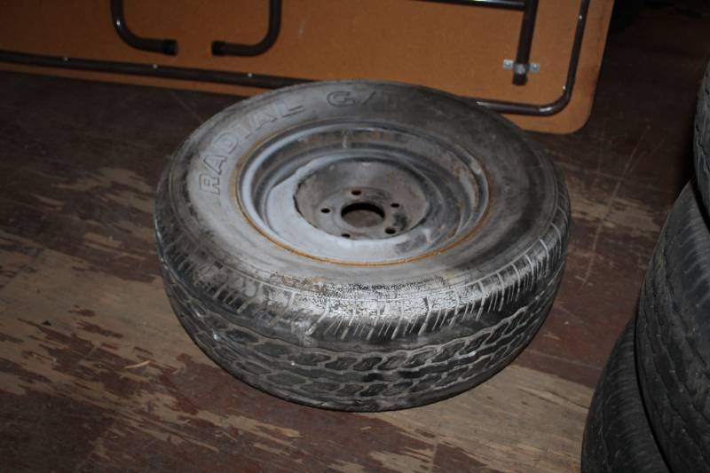 lot 26 image: Cooper Radial GT P21570R14 White Letter Tire w 5-Lug Steel Wheel