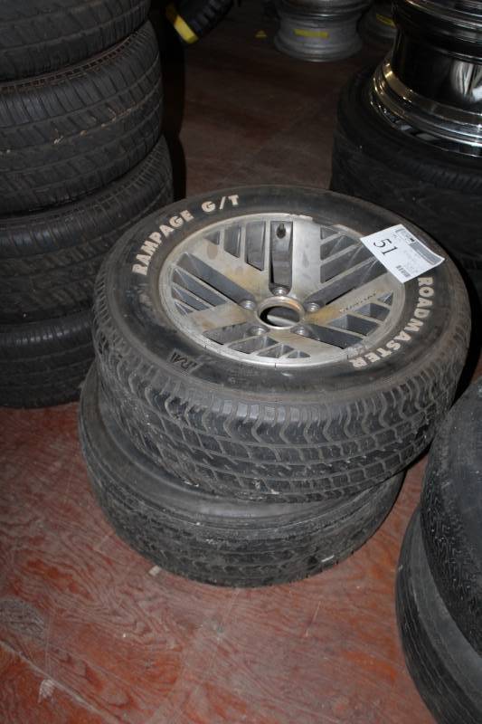 lot 51 image: Lot of (2) Roadmaster Rampage GT P23560R15 White Letter Tires w 1) 15in. 5-Lug Pontiac Wheel