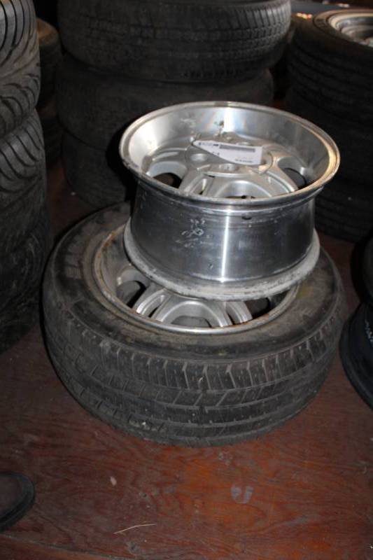 lot 58 image: Lot of (2) 16in. 5-Lug Wheels w 1) Goodyear Eagle GA P23555R16 Tires