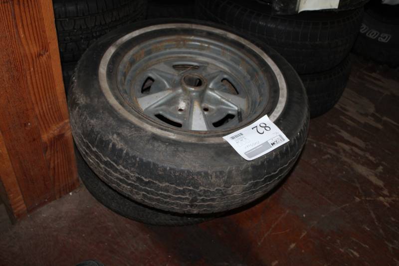 lot 82 image: P20575R15 Whitewall Tire w 15in. 5-Lug Pontiac Wheel