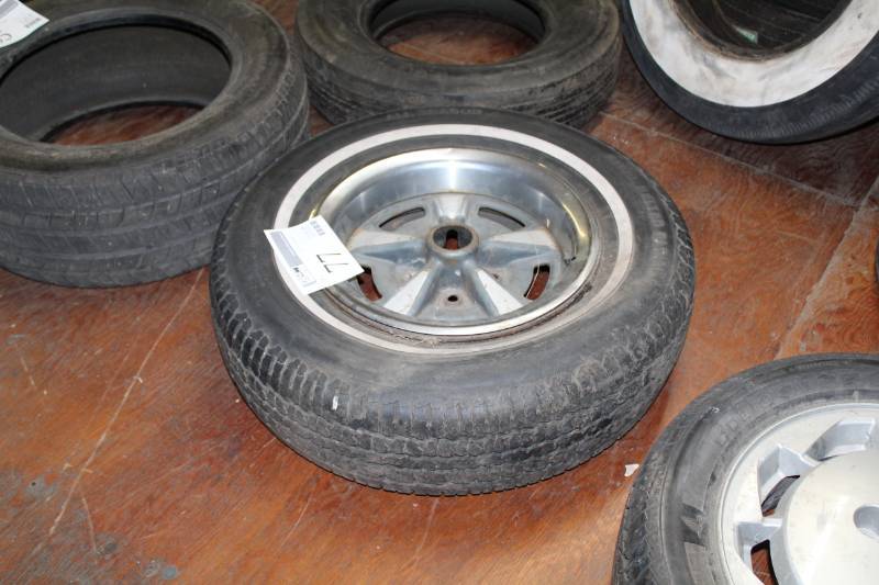 lot 77 image: P21575R15 Whitewall Tire w 15in. 5-Lug Pontiac Wheel