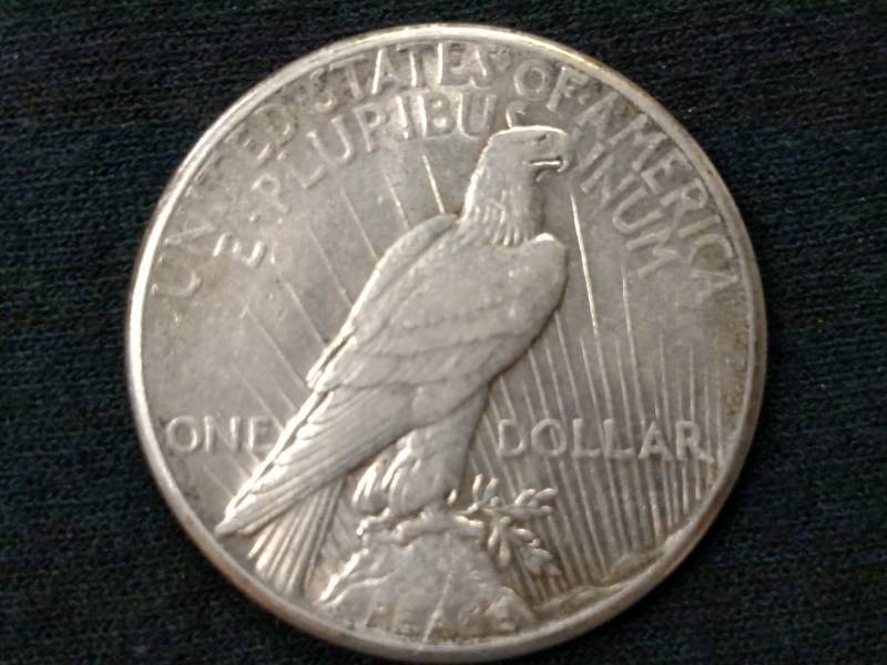1928 AU Peace Silver Dollar...