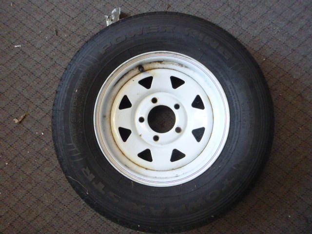 lot 100 image: NEW White Spoke Trailer Tire