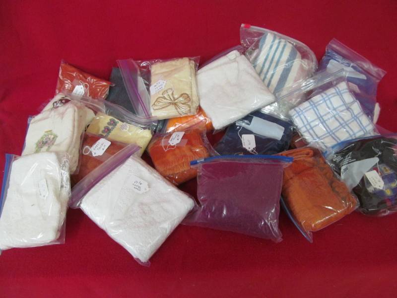 lot 25 image: Group of hand towels, container not included
