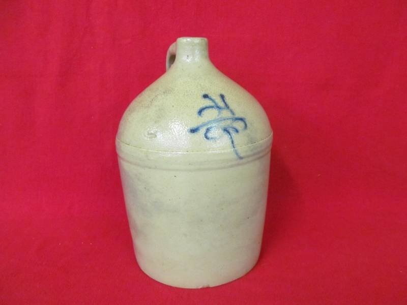 lot 44 image: Vintage salt glazed jug with markings with 17 tall turkey eye