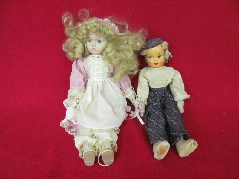 lot 50 image: Doll in pink and white porcelain, Poland Pheasant girl doll cloth composition face