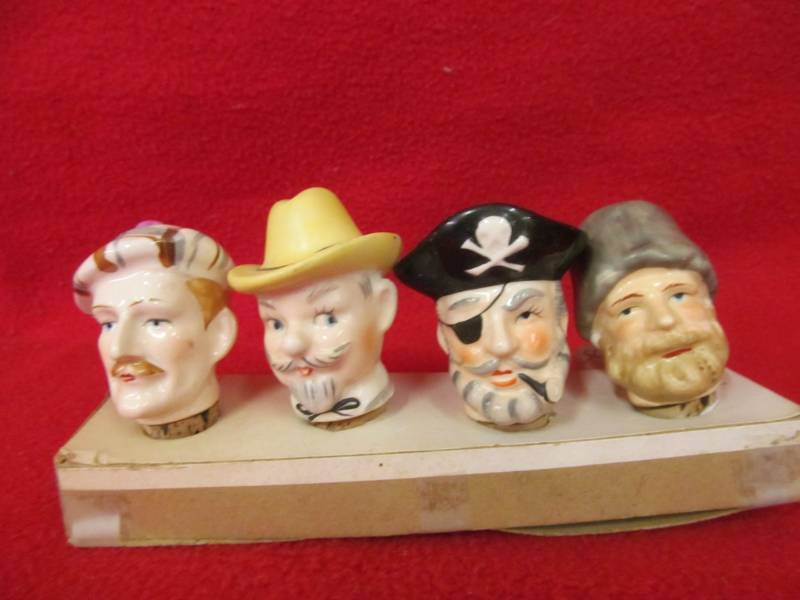 lot 139 image: Set of 4 Ceramic Bottle heads