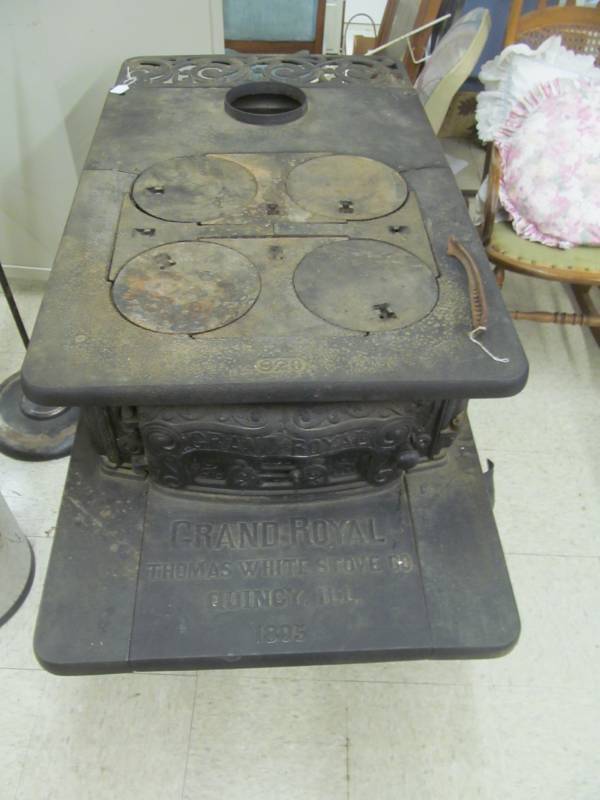 lot 143 image: Grand Royal Thomas White Stove Co, Quincy ILL 1895 #820 4 hole burners, Cast iron stove (52 x 28 x 30 12)