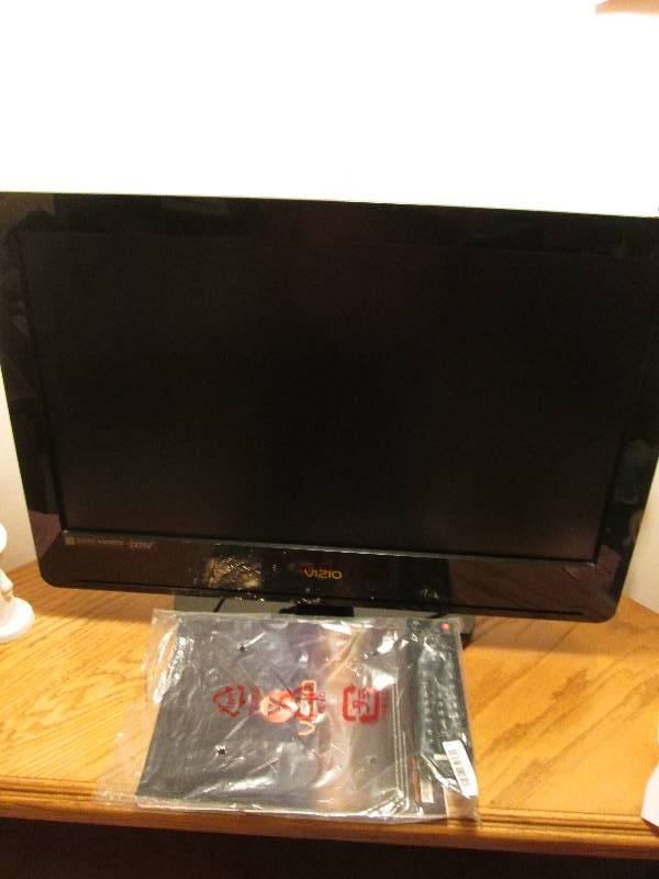lot 193 image: VISIO Television with remote and ma...
