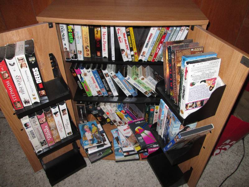 lot 235 image: Movie cabinat with misc movies...