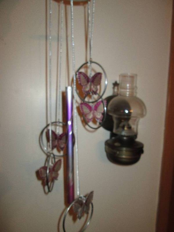 lot 276 image: Butterfly chimes and Oil lamp...