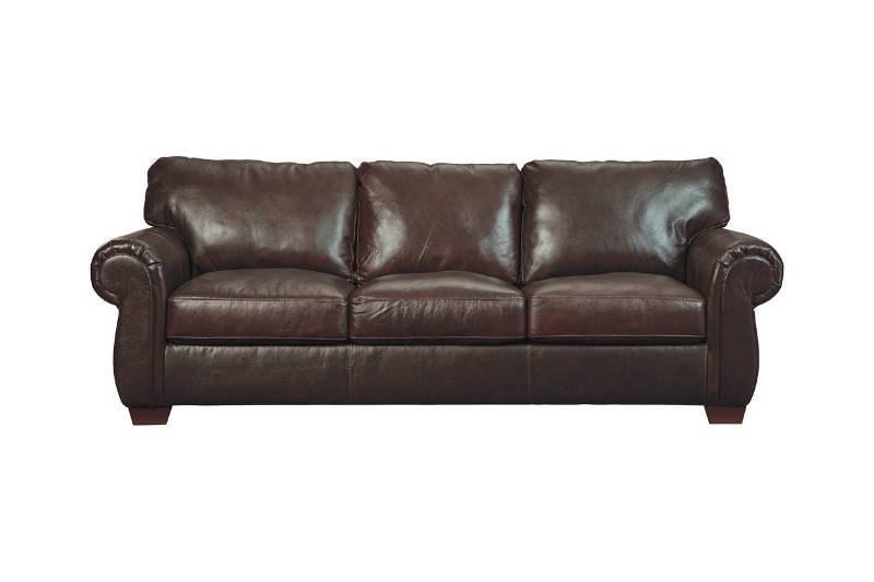 lot 9 image: Ashley Furniture Lorton Chocolate Genuine Leather Sofa, Model 9840038 - New