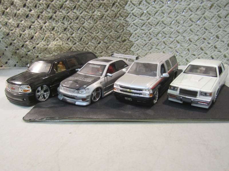 lot 49 image: Lot of 4 Jada 124 Scale Die Cast C...
