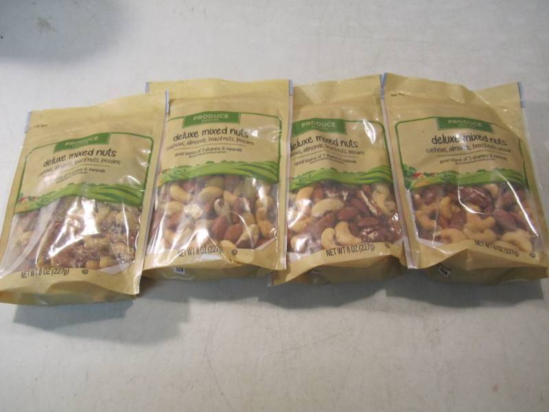 lot 124 image: 4 Bags of Deluxe Mixed Nuts Best by...