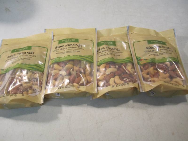 lot 125 image: 4 Bags of Deluxe Mixed Nuts Best by...