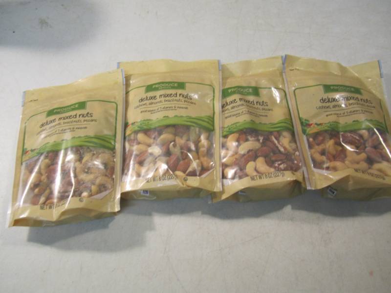 lot 126 image: 4 Bags of Deluxe Mixed Nuts Best by...