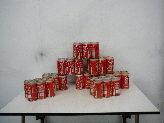 lot 31 image: Vintage Coke Cans