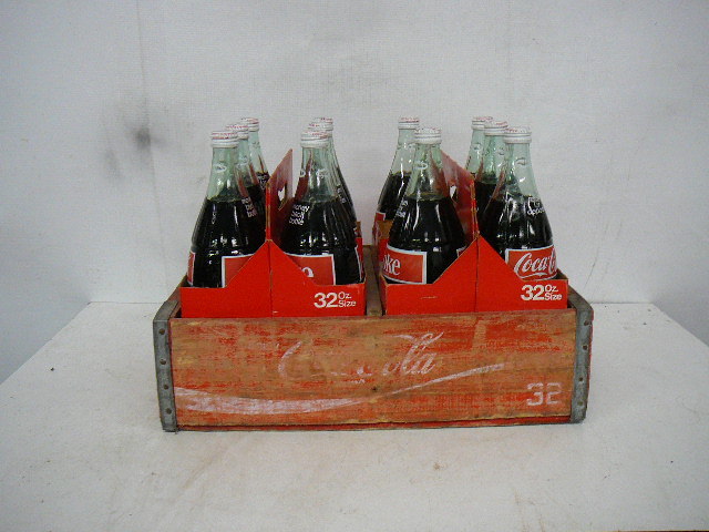 lot 35 image: Wooden Coke Case & Coke quarts