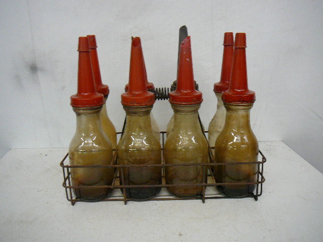 lot 45 image: Vintage Oil Bottle Rack with Bottles