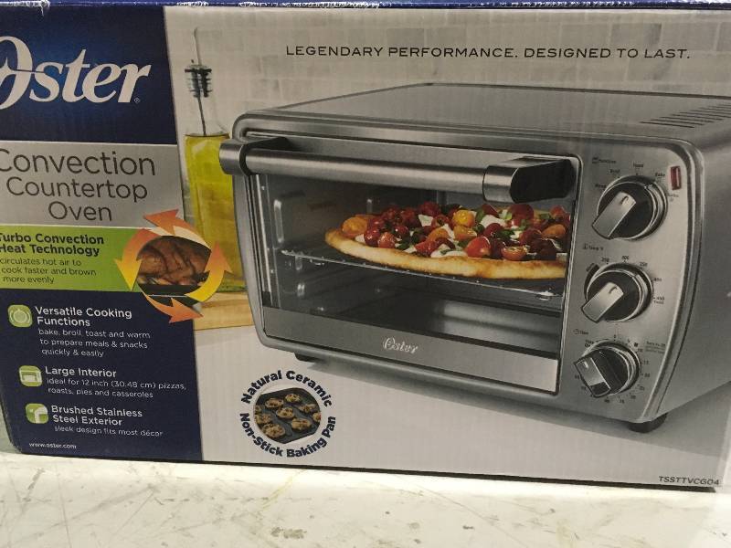 lot 42 image: Oster Stainless Steel Convection Countertop Oven Toaster Oven Timer & Baking Pan open box not used