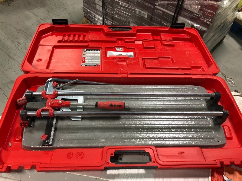 lot 104 image: Rubi 26 in. TS-MAX Tile Cutter used in working conditions