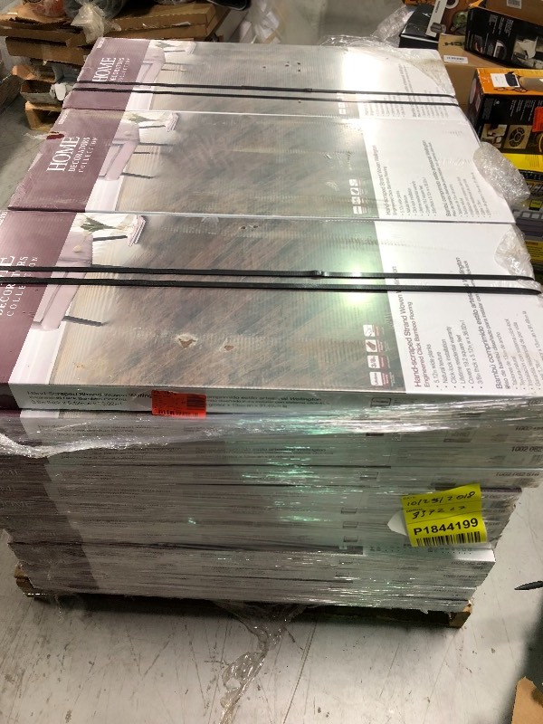lot 102 image: Home Decorators Collection Hand Scraped Strand Woven Wellington 38 in. T x 5-18 in. W x 36 in. L Engineered Click Bamboo Flooring 37 cases no used