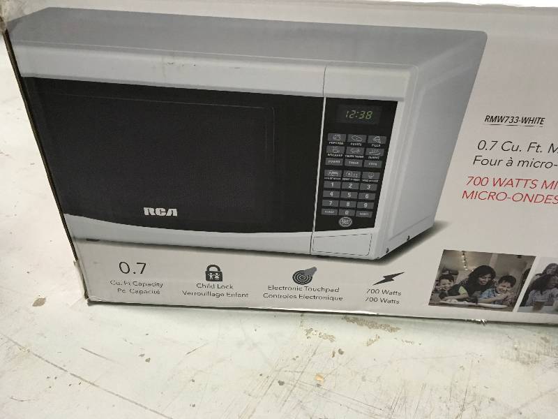 lot 16 image: RCA 0.7 cu. ft. Countertop Microwave in White open box in good condition