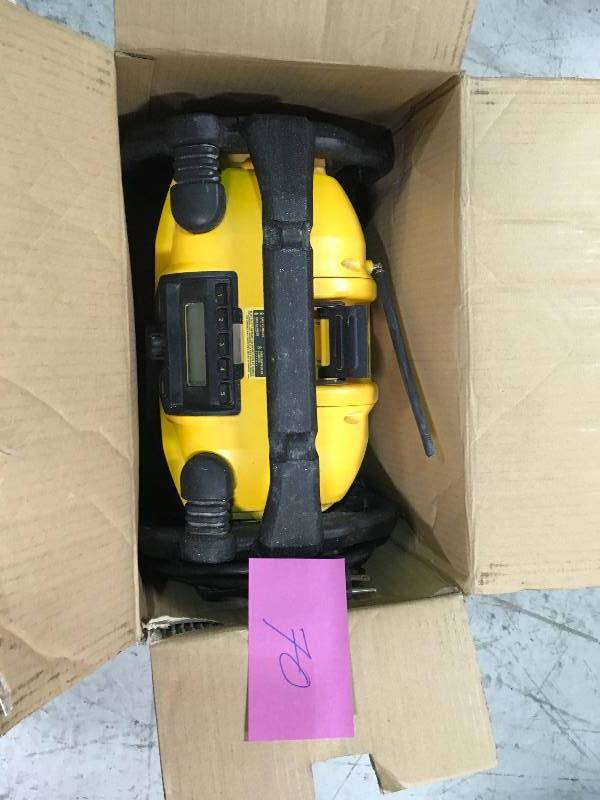 lot 70 image: DEWALT 12-Volt20-Volt Max Charger and Radio  Used in good working cond.