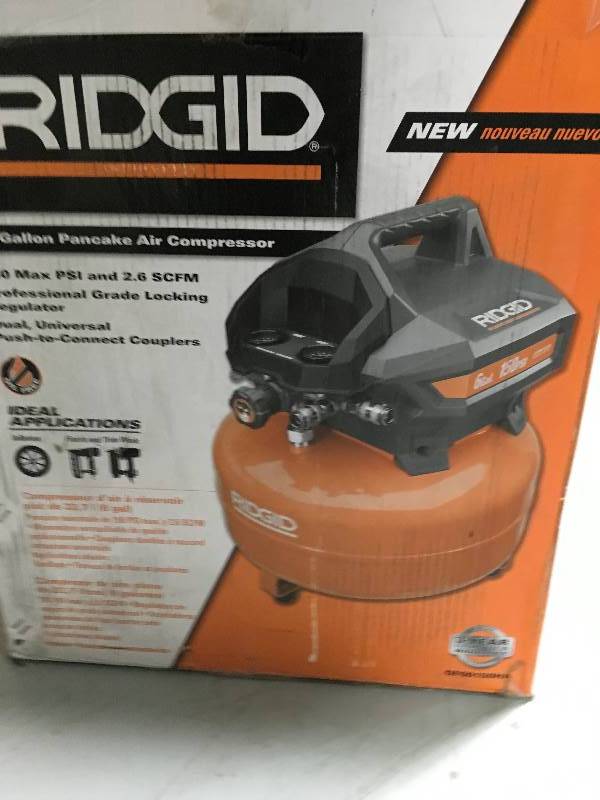 lot 33 image: RIDGID Horizontal Large 6 Gal. Capasity Portable Electric Pancake Compressor open box  in good working condition