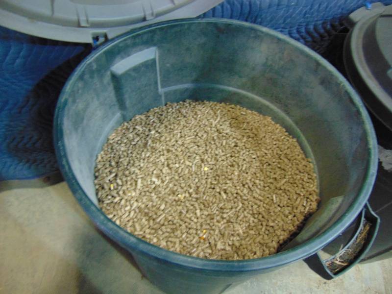 lot 28 image: (2) Garbage Cans Of Wood Pellets and Corn Mix