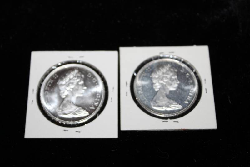 lot 216 image: Lot of (2) 1966 Canadian Silver Dollars