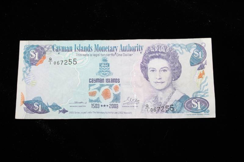 lot 299 image: 2003  CAYMAN ISLANDS COMMEMORATIVE QUINCENTENNIAL DOLLAR