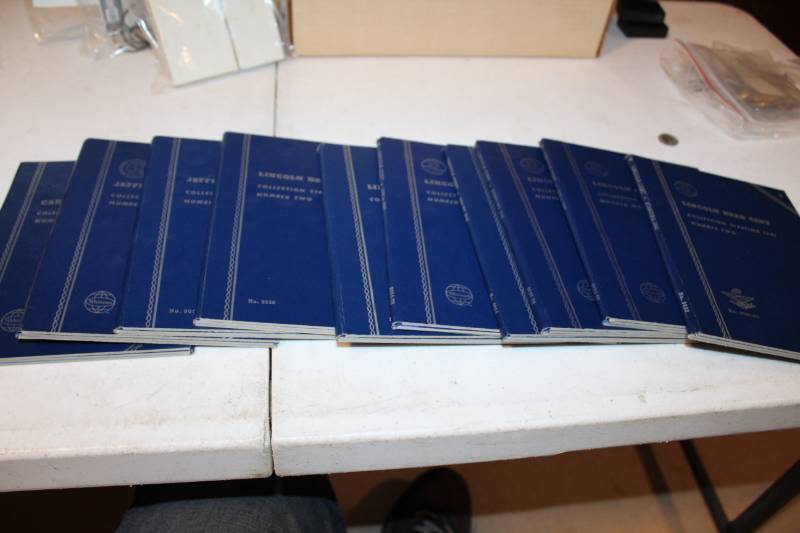 lot 348 image: Lot of (10) Blue Collector Folders Mostly Full, Missing Some KEY dates