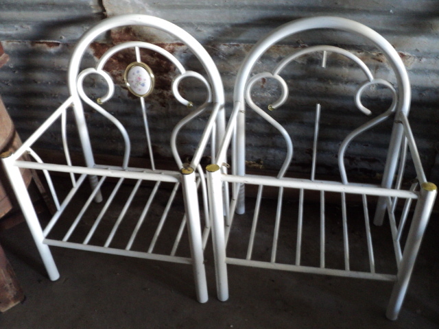 2 white metal pieces of furniture...