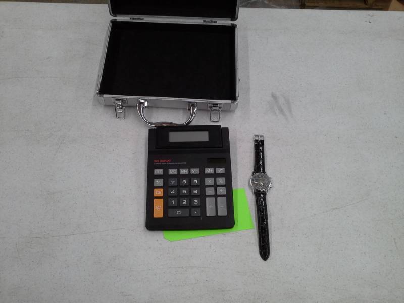 lot 205 image: Case, Calculator and a Watch