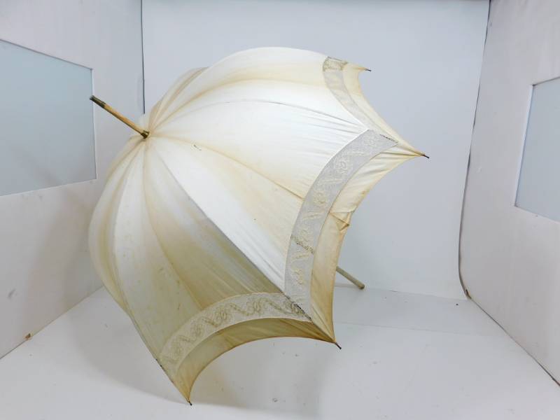 lot 18 image: Vintage Creme Colored Cloth Umbrella With A Wooden Handle