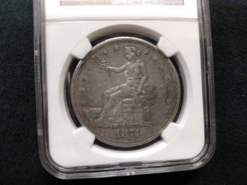 1874 S NGC AU50 Trade Silver Dollar...