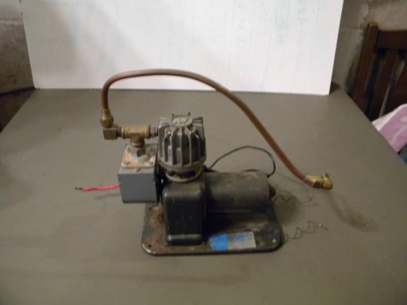 lot 61 image: K.J. Miller Corp 12 volt Air Compressor #4000