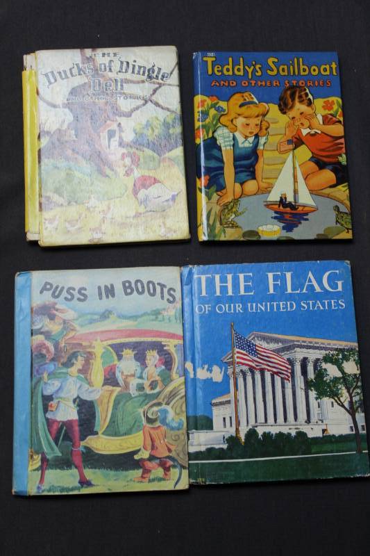 lot 12 image: Teddys Sailboat and Other Stories, The Flag of our United States, Puss In Boots #886 The Little Color Classics, The Ducks of Dingle Dell and Other Stories #847 The Little Color Classics