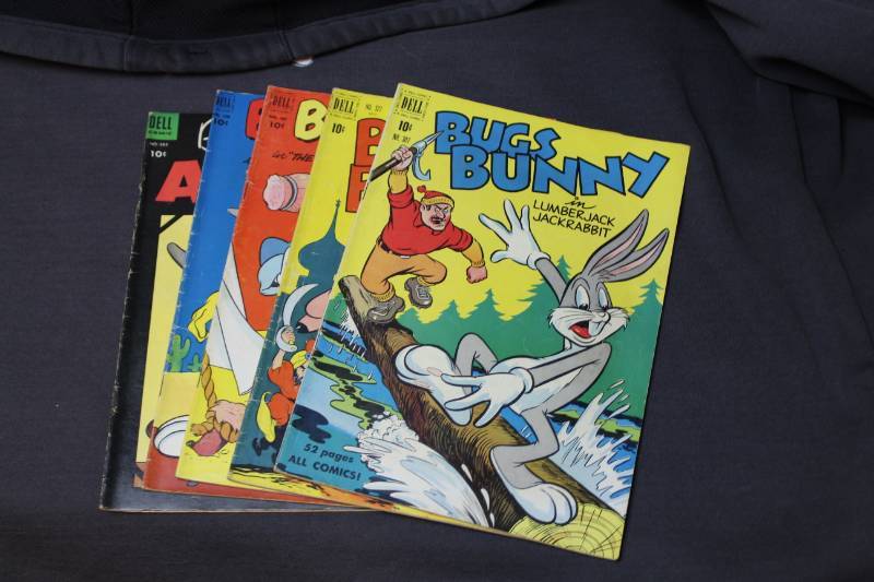 lot 29 image: Dell Bugs Bunny Comic Books - Lumberjack #307, Rajahs Elephant #327, The Foreign Legion Hare #407, Mysterious Buckaroo #420, Album #585