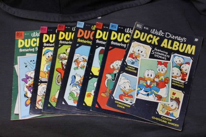 lot 27 image: Dell Walt Disneys Duck Album Comic Books - #353,450,492,531,560,586,611