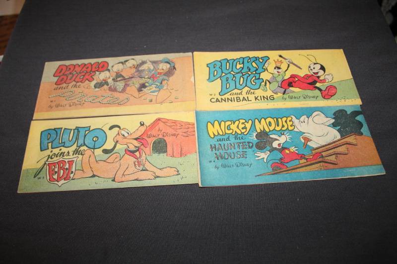 lot 52 image: Walt Disney Comic Books - Donald Duck Pirates, Pluto Joins The FBI, Bucky Bug Cannibal King, Mickey Mouse Haunted House